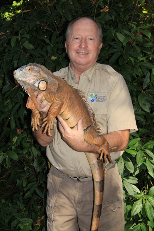 Gregg Greer holds his large male Iguana.